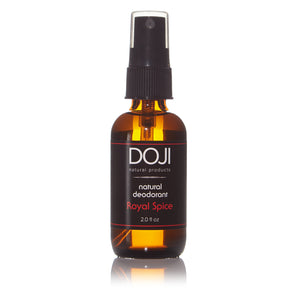 Doji natural deodorant, bottle product shot, royal spice scent, amber glass spray bottle, on white background with reflection.