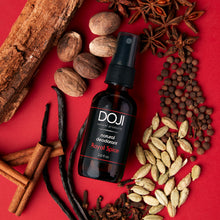 Load image into Gallery viewer, Doji natural deodorant, royal spice scent, overhead shot with spices, cardamom, vanilla bean, cloves, allspice, nutmeg, sandalwood, and star anise.